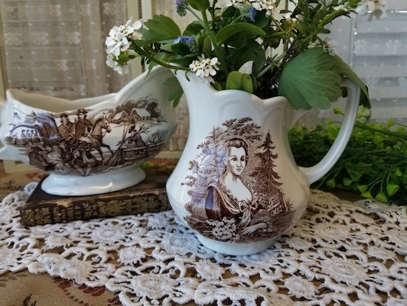 Charming pair of Americana style Ironstone J&G Meakin pitchers. This ironstone creamer and gravy boat really shine in a farmhouse vignette.