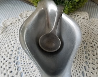 Mid-century Guardian brand gravy boat with small pewter ladle. The marrying of this mid-century gravy or sauce boat and ladle seems natural.