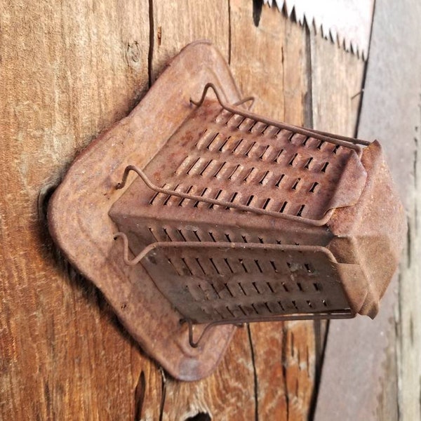 Rusty crusty vintage stove top toaster. This aged old toaster is how the old timers used to crisp up their bread on stove top or open fire.