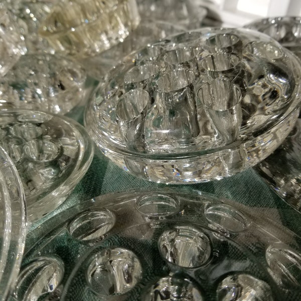 Vintage glass flower frog. Whether you use them or simply display them, these brilliant sparkling disks are a beautiful reminder of life.