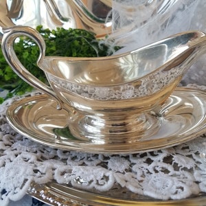 Gorgeous and gleaming Gorham silver plated sauce boat. This elegant silver plated gravy boat has an attached plate beneath. image 7