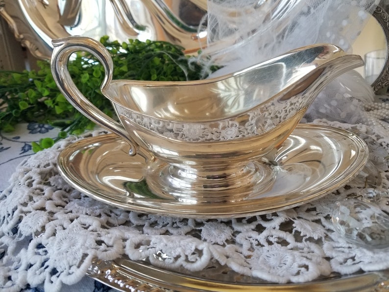 Gorgeous and gleaming Gorham silver plated sauce boat. This elegant silver plated gravy boat has an attached plate beneath. image 7