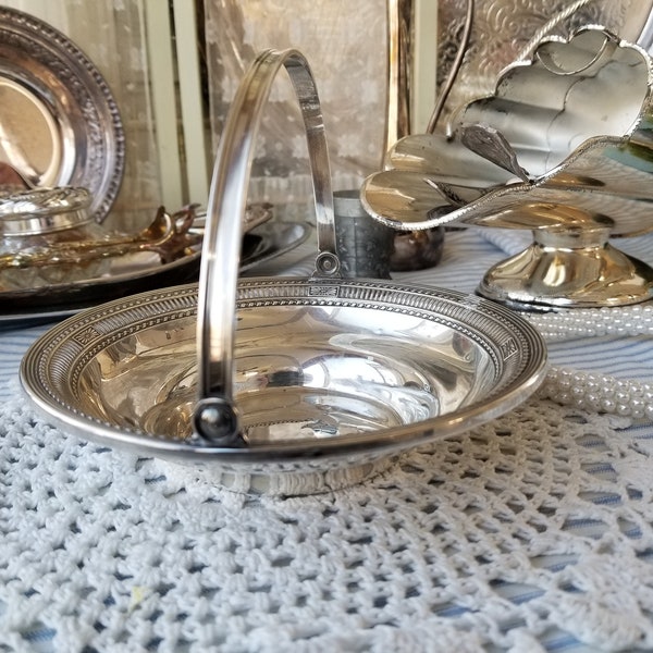 Vintage sterling silver reticulated candy basket. This sweet lightweight Sterling silver basket does have an engraving on the bottom.