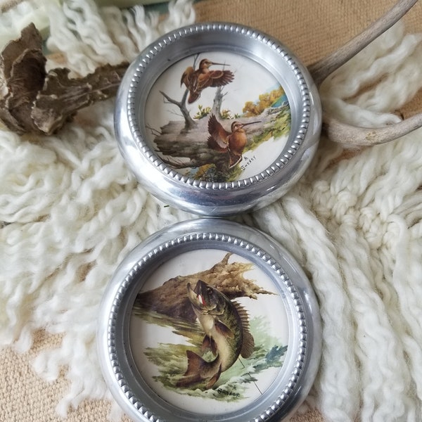 Gorgeous and gleaming duo of  silver plated wildlife coasters. These 2 Fred Sweney wildlife coasters are perfect for a gentleman's Library.