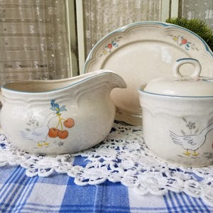 Cute cottagecore creamer and sugar bowl. This vintage blue bow country goose sugar and creamer would fit wonderfully in a cottage kitchen!