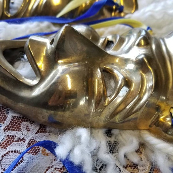 Fabulous pair of heavy brass New Orleans Mardi Gras muse and tragedy masks. These two Mardi Gras vintage brass hypocrite mask are fabulous.
