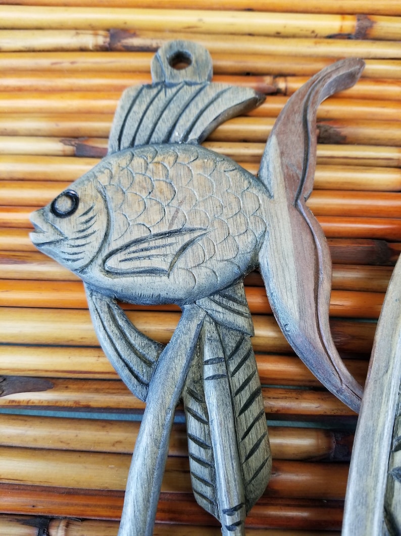 Beautifully hand-carved tropical themed wall hanging Ideal for a jungle or Tiki Room This 3 piece wall hanging features a toucan and fish