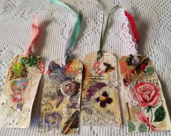 Beautiful hand crafted junk journal tags. Each one is unique in an array of designs. I decoupaged each using a variety of paper and others.