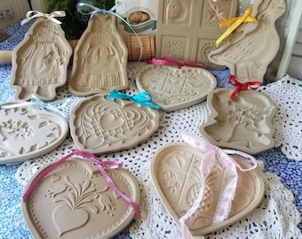 Delightful cottage style stoneware cookie presses. You choose from 10 of these  brown bag art or Pampered Chef stoneware cookie presses.