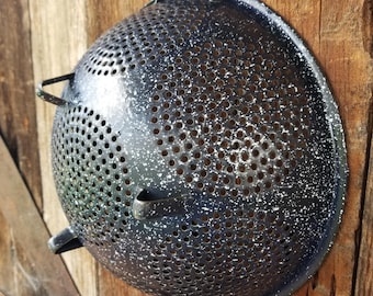 Charming old cobalt blue enamelware colander strainer. This speckled blue enamelware colander is full of rustic farmhouse kitchen charm.