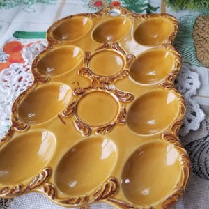 Gorgeous squared mid-century ceramic deviled egg tray. This Charming mid-century gold colored ceramic egg plate is beautiful.