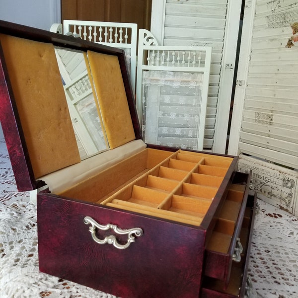 Mid-century rich burgundy and gold  decorative Mele jewelry case. This gorgeous vintage Mele jewelry case speaks of mid-century elegance.