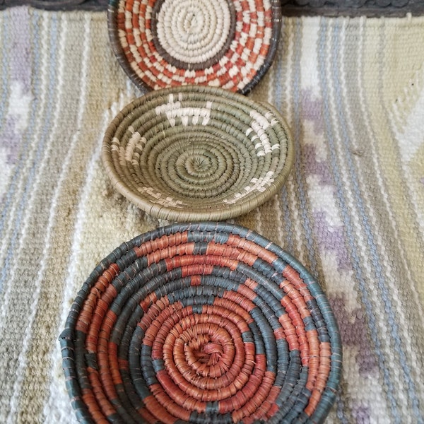 Beautiful Trio of hand woven Native Alaskan baskets. These three diminutive aleut Eskimo baskets are woven from pine needles and grasses.