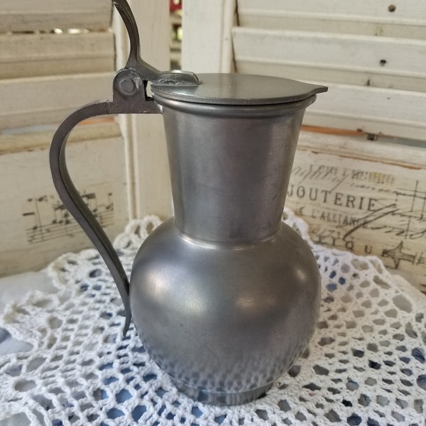 Charming antique rein zinn pitcher made in Germany. This sweet Zinn German made Farmhouse pewter pitcher has primitive charm.