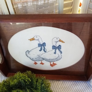 Sweet little country goose serving tray. Adorned with two cross stitch Blue Ribbon geese, this wood serving tray belongs in your farmhouse.