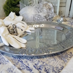 Beautiful oval Wilton Armetale serving platter. This gorgeous shimmering Grapevine adorned pewter platter is perfect for cheese and wine.