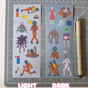 May include: Two sheets of stickers with different themes. The left sheet has a light background and features cartoon characters in orange jumpsuits. The right sheet has a dark background and features cartoon characters in orange jumpsuits with a more sinister theme.