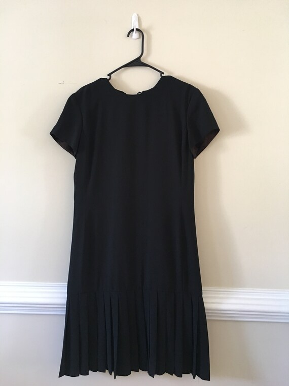 dress with pleats at the bottom