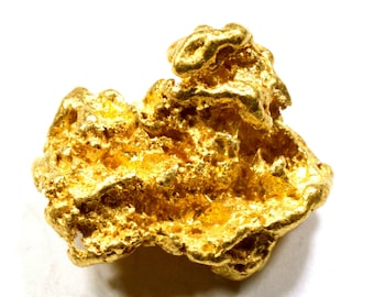 Puede incluir: Una pepita de oro grande e irregular. El oro es de un amarillo brillante y tiene una superficie rugosa y texturizada.
