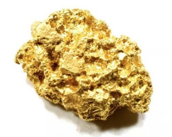 May include: A large, irregularly shaped nugget of raw gold. The gold has a rough, textured surface and is a bright, shiny yellow color.