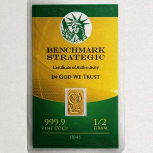 Barra de ouro fino 24k de 1/2 grama .9999 “ESTÁTUA DA LIBERDADE” - Em cartão coa