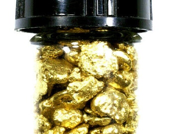 May include: A glass jar with a black lid filled with small, irregular pieces of gold nuggets.