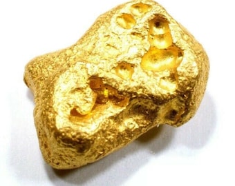 May include: A large, irregularly shaped nugget of gold. The gold is a bright, shiny yellow color and has a rough, textured surface.