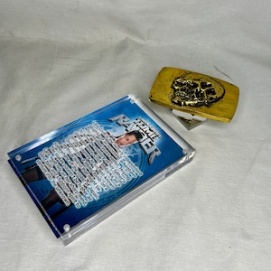 Tomb Raider, Skull Belt Buckle, Real Prop Replica, Acrylic Display Plaque and Item Stand, Metal, Gold, Signed, Numbered, Limited Edition