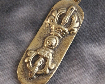 Reversible amulet with Dorje, OM and Chattra (569)