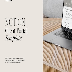 May include: A laptop computer displaying a Notion client portal template on the screen. The laptop is on a light brown wooden table with a white notebook and a glass of coffee.