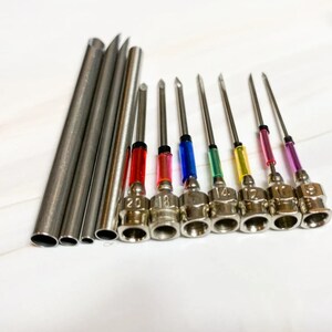 May include: A set of 10 stainless steel needles with colored plastic tips. The needles are labeled with numbers 12, 14, 16, 18, 20, 22, 25, 27, 30, and 32.