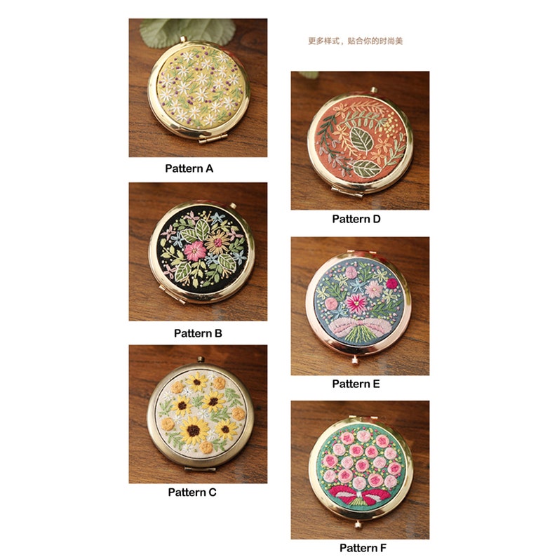 May include: Six round, gold-rimmed compact mirrors with different floral embroidery designs. The designs include a yellow and white floral pattern, a black background with pink and green flowers, a yellow background with sunflowers, a red background with orange and green leaves, a blue background with pink and white flowers, and a green background with pink and white flowers.