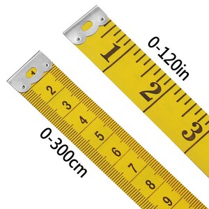 May include: Two yellow measuring tapes with black markings. The top tape reads "0-120in" and the bottom tape reads "0-300cm".