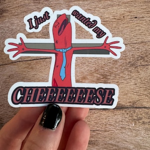May include: A red cartoon figure with a blue tie is nailed to a cross with the text "I just wanted my CHINESE" below. The figure has a distressed look on its face and is wearing a blue tie.