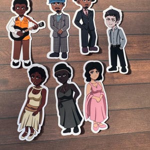 May include: A collection of seven die-cut stickers featuring illustrated characters in various outfits. The top row shows four figures in suits and formal wear, while the bottom row displays three figures in dresses. Each sticker has a white border.