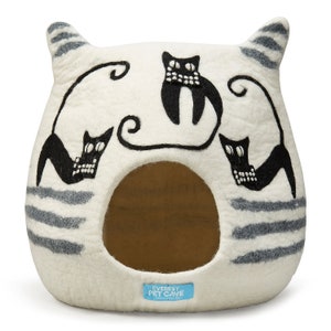 May include: White felt cat bed with a gray striped pattern and black cat illustrations. The bed has a round opening and the text "EVEREST PET CAVE" is printed on the front.