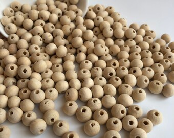 100 Engraved 10mm Round Natural Beige Wood Beads with Brown Burned Cross Design 100 Engraved 10mm Round Natural Beige Wood Beads with Brown Burned Cross Design