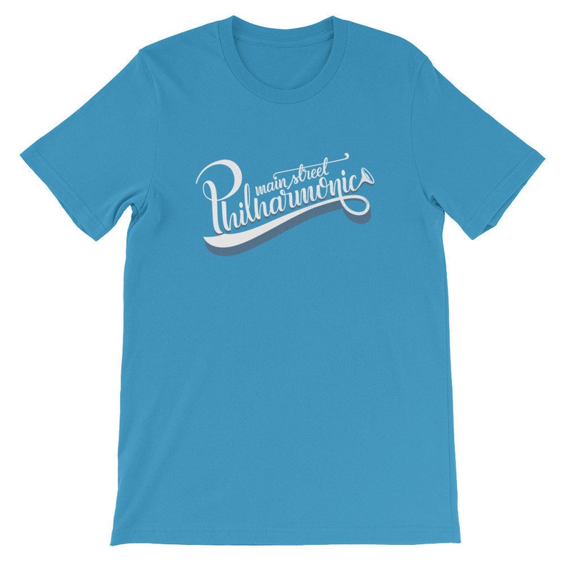 May include: A light blue t-shirt with a white graphic that says "Main Street Philharmonic" in a stylized font with a musical note.