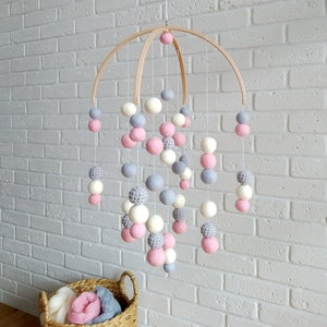 Baby mobile for girl. Decor in nursery girl. Baby mobile made of wool balls and crocheted balls.