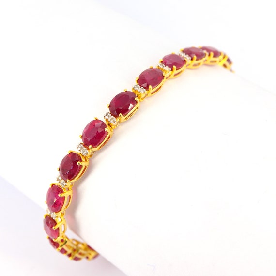 Sold at Auction: 14K Yellow Gold, Ruby and Diamond, Floral Bracelet