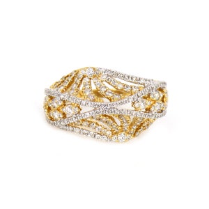 May include: A gold ring with a delicate, intricate design featuring multiple bands of small diamonds.