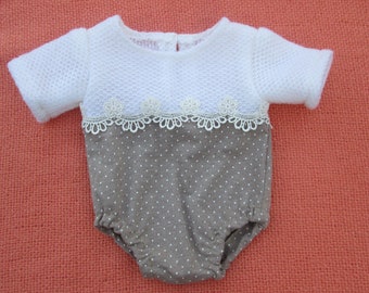 Newborn romper and bonnet decorated with lace