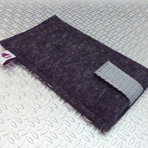 May include: A dark gray felt phone case with a gray fabric strap and a small purple owl logo.
