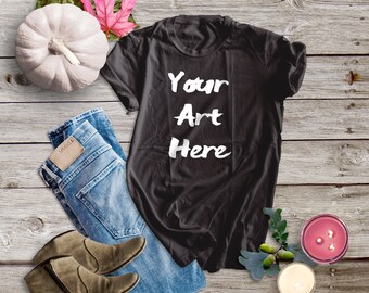 Download Free Bella Canvas 3001 Black Shirt Mockup | Fall Shirt Mockup for Black T-Shirt | Black Shirt Flat Lay with Pumpkin on Barn Wood Floor PSD Template