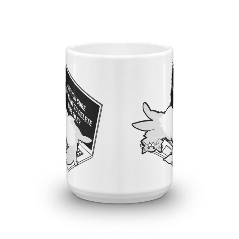 May include: White ceramic mug with a black and white illustration of a cat sitting on a laptop. The laptop screen displays a pop-up message that reads "Are you sure you want to delete this file?"