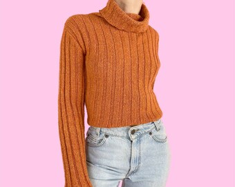 orange turtleneck top