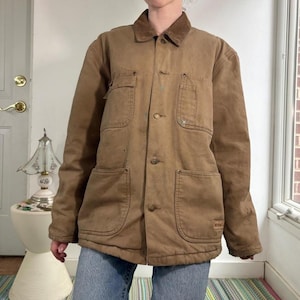 Vintage distressed tan canvas chore work coat by Wolverine size men’s small