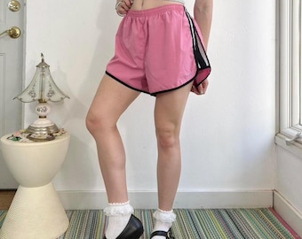 Pink and black striped athletic shorts by Nike Size XL