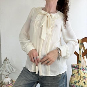 Cream lace peter pan collar puff sleeve button up peasant blouse with a bow neckline by Lauren Conrad  Size small