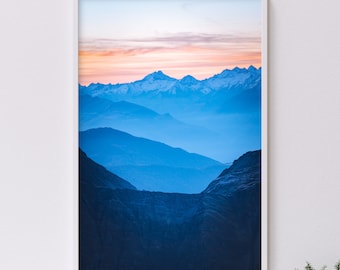 Sunrise over the Alps as seen from Mont Blanc towards the valley of Courmayeur, landscape photography showing the foggy layers of mountains